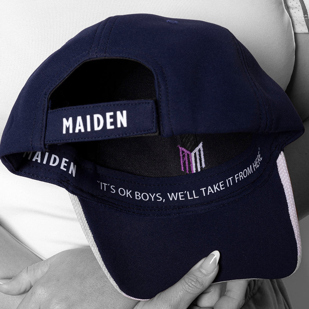 Navy blue cap with 'MAIDEN' branding held by a person