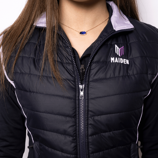 Person wearing a black gilet with a logo on a white background