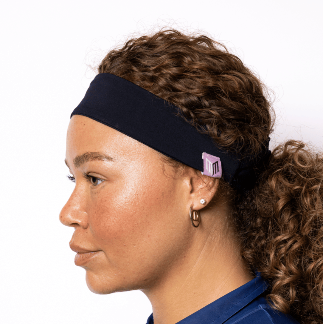 Woman wearing a blue headband with a logo on a white background