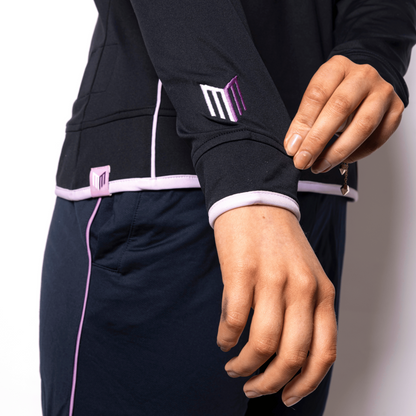 Person wearing a black outfit with pink accents on a white background