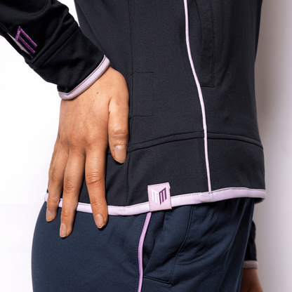 Navy tracksuit with white and pink accents on a plain background