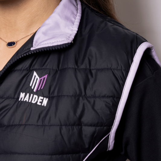 Black gilet with 'MAIDEN' logo on a neutral background